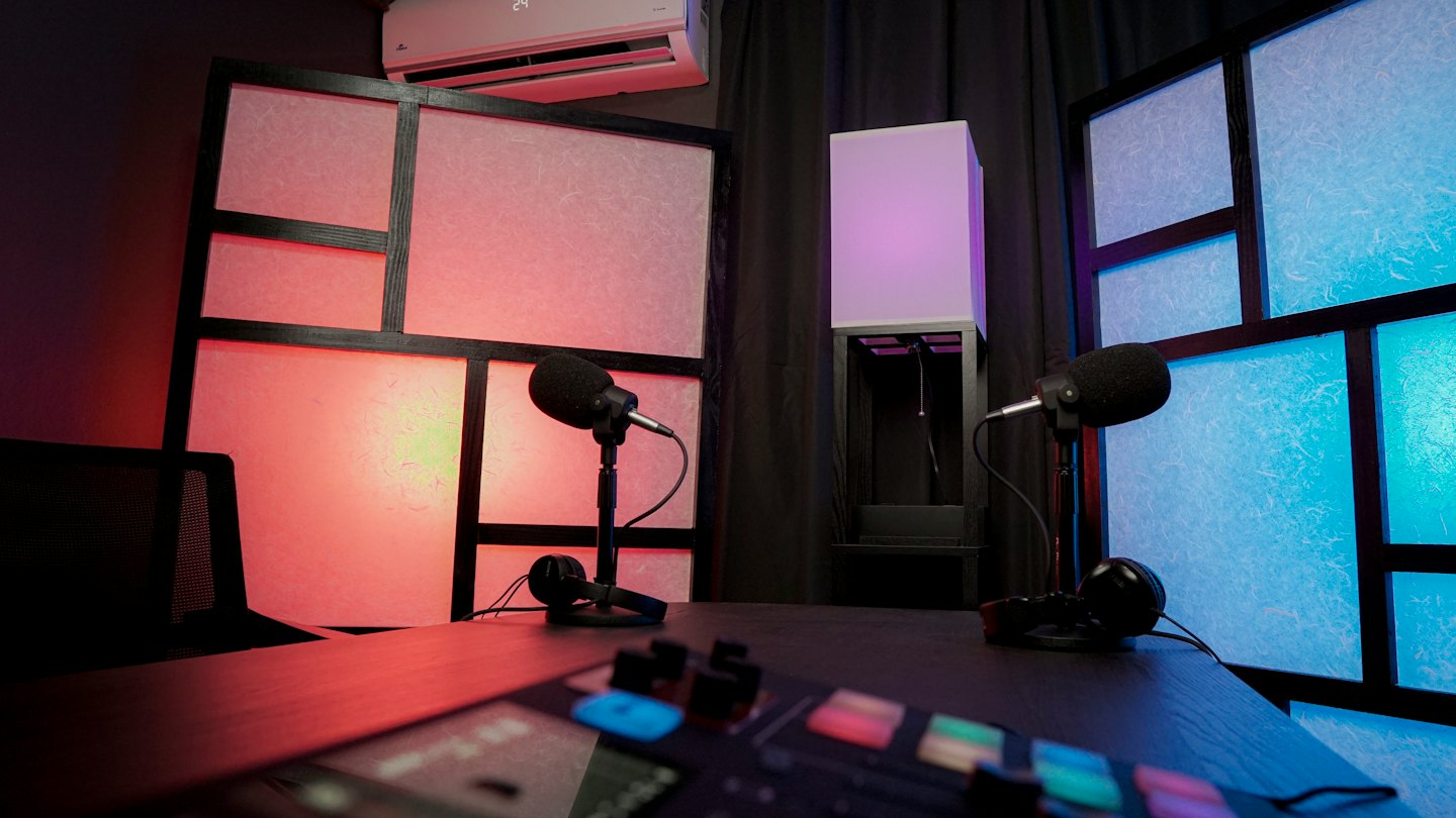A podcast studio with microphones, headphones, and mixing board.